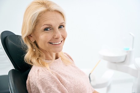 A smiling woman at a dentist’s office
