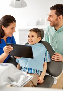 a child smiling during a dental checkup