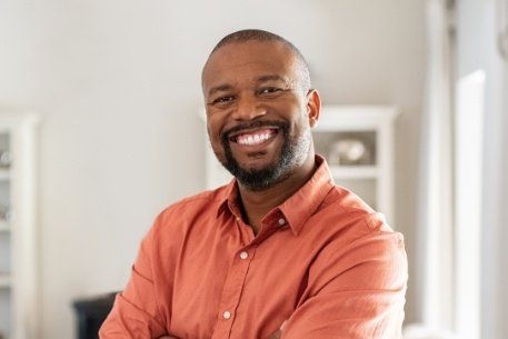 Man with dental bridge smiling