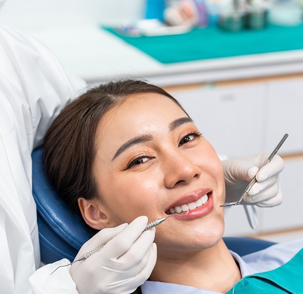 Woman smiling in the dental chair