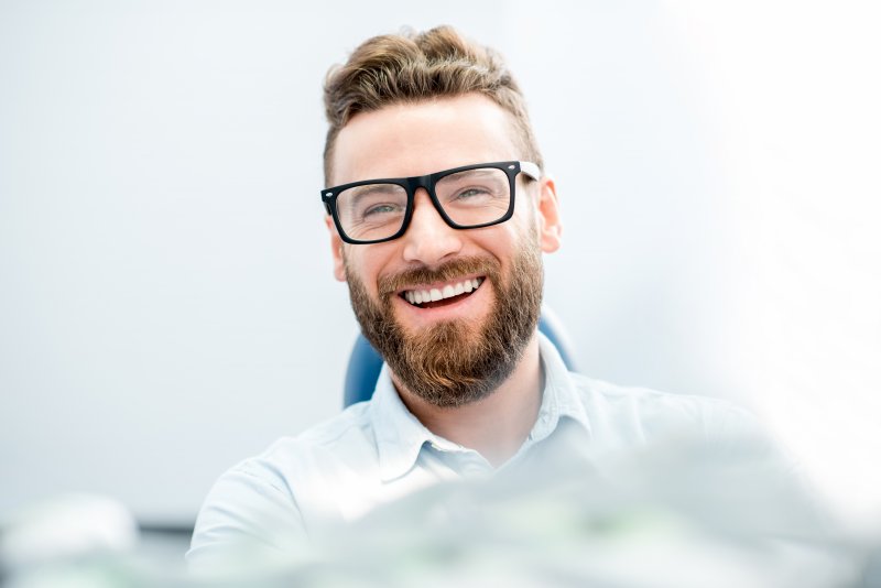 person with porcelain veneers smiling