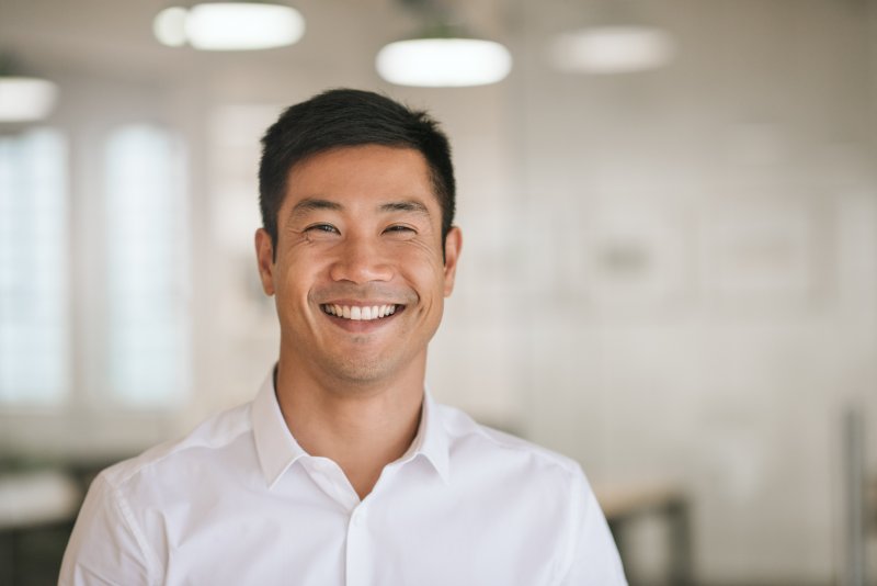 person with dental implants smiling