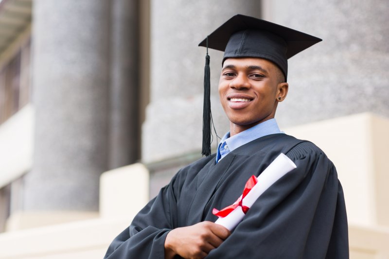 graduate smiling for the camera