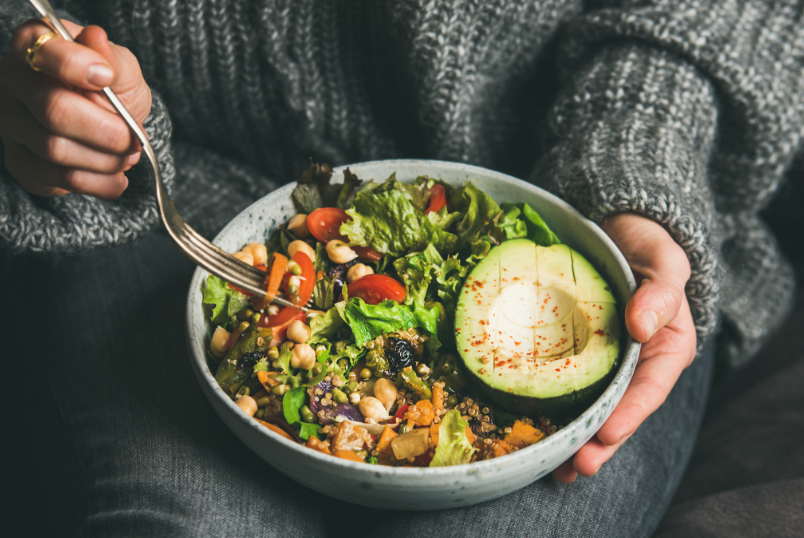 Woman eating a salad bowl